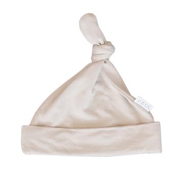 White background with an Oatmeal Newborn Knot Hat by Mebie Baby. Knot hat is a pale grey/beige, it fits snug with a knot at the top.