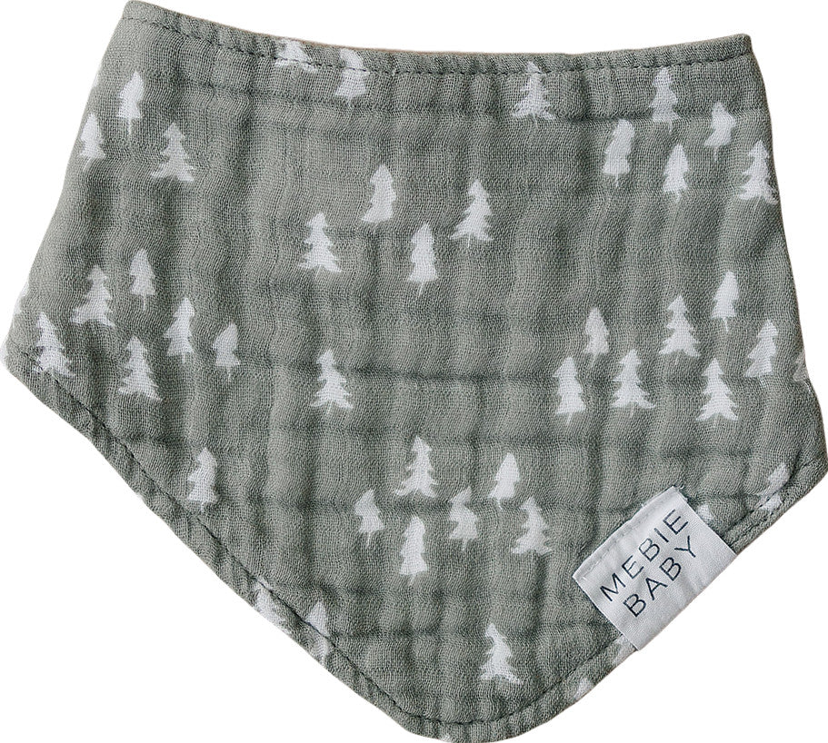 White background with the Pines Bib by Mebie Baby. Bib is a soft olive green with white pine trees all over.