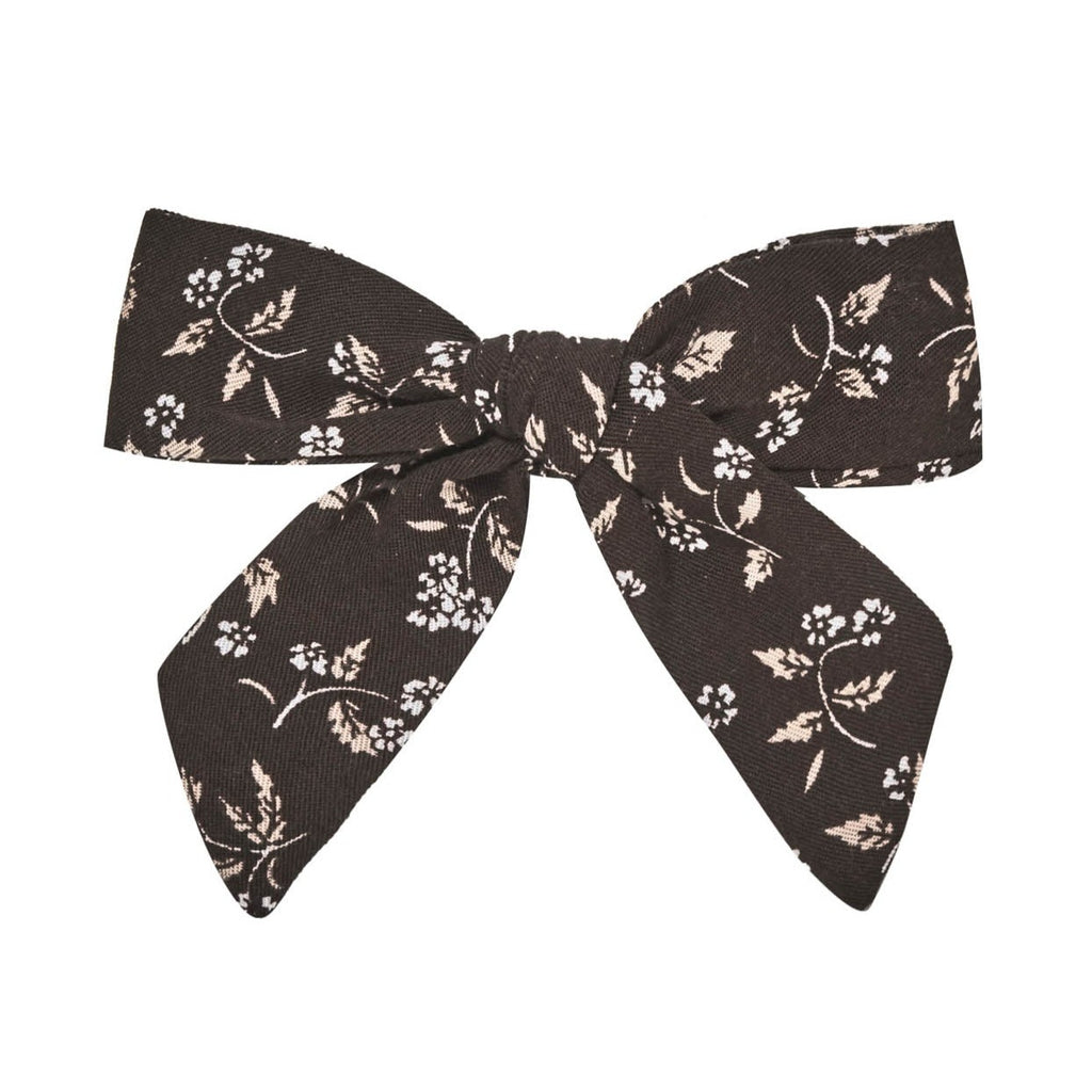 White background with Girly Bow with Clip in Black Floral by Rylee and Cru.
