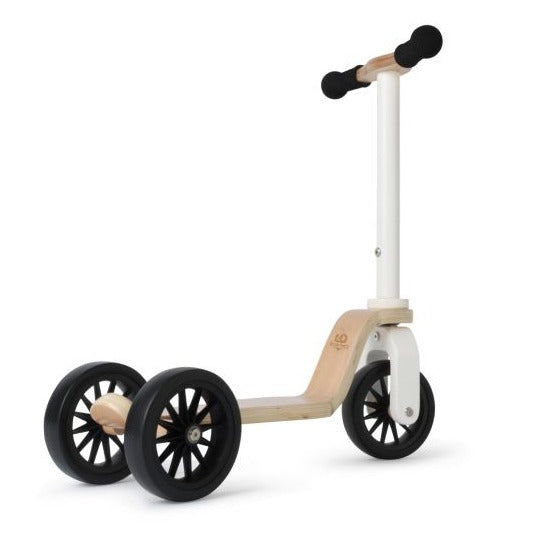White background with Kinderscooter by Kinderfeets. Scooter has a white bar at the front, with wood details on the scooter, and 3 black wheels. Handlebars are black.