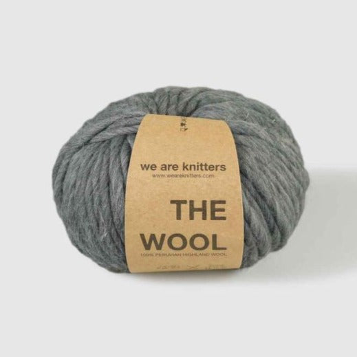 Spotted Dark Grey Wool by We Are Knitters with a white background. 