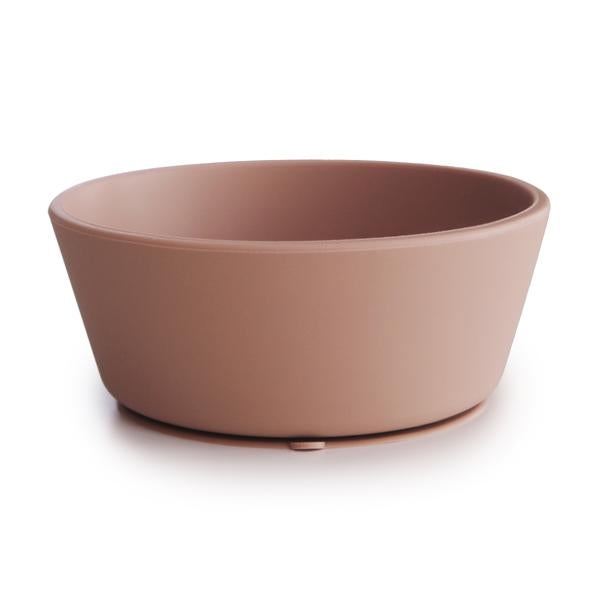White background with Silicone Suction Bowl in Blush by Mushie. Bowl has a suction base, and is blush.