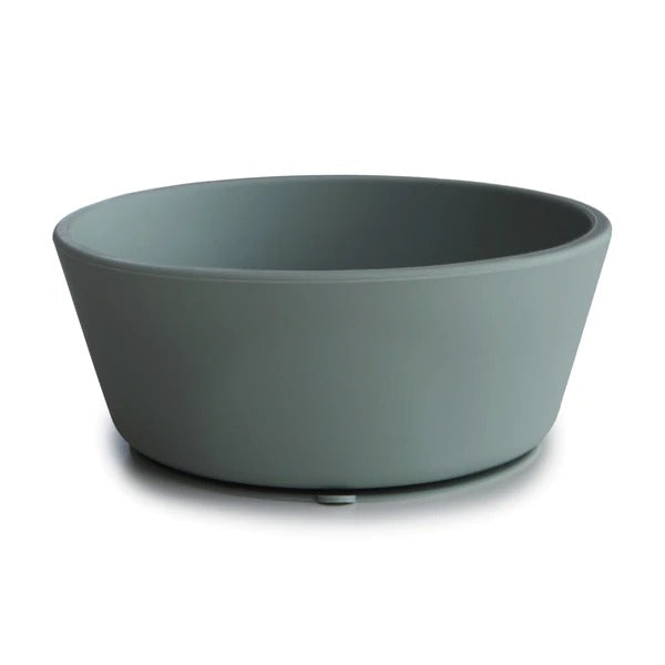 White background with Silicone Suction Bowl in Dried Thyme by Mushie. Bowl has a suction base, and is a grey green colour.