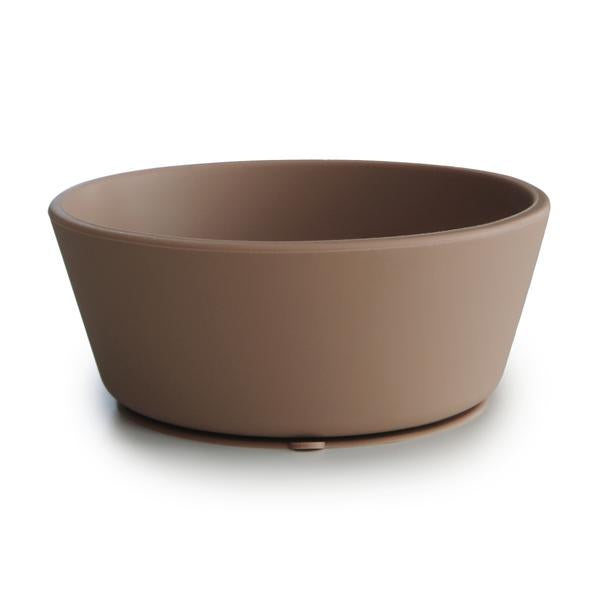 White background with Silicone Suction Bowl in Natural by Mushie. Bowl has a suction base, and is a pale brown colour.