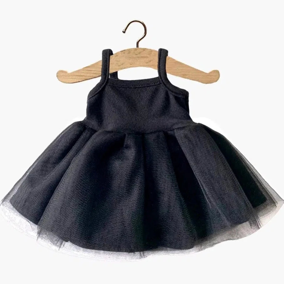 White background with Rosella Tutu for Dolls in Black by Minikane. Tutu is a spaghetti strap bodice with a black tulle skirt.