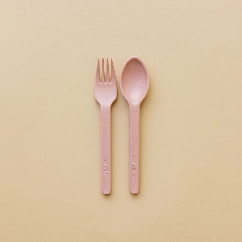 Beige background with the Wheat Straw Set in Blush by Minika. Set includes one fork, and a spoon in a blush colour.