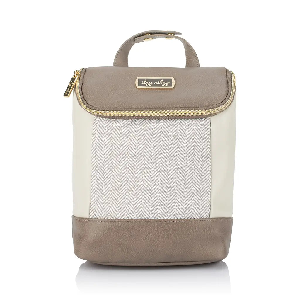 White background with Chill Like A Boss™ Bottle Bag in Vanilla Latte by Itzy Ritzy. This bag is cream with a beige/grey colour as well, and a chevron pattern down the front. Zipper is hold, with gold snaps, and a gold tag that says "itzy ritzy".