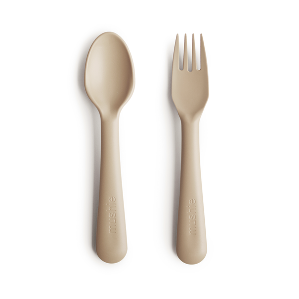 White background with Fork and Spoon Set in Vanilla by Mushie. They come in a beautiful beige colour.