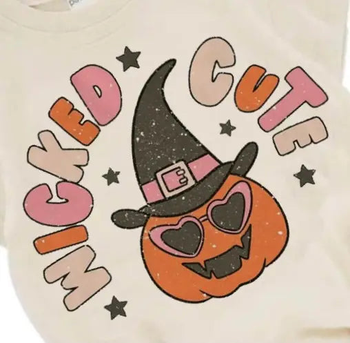 Close up of the design on the Wicked Cute Halloween Romper by Boho + Babe. Showing the details of the pumpkin, and the colourful bubble font.