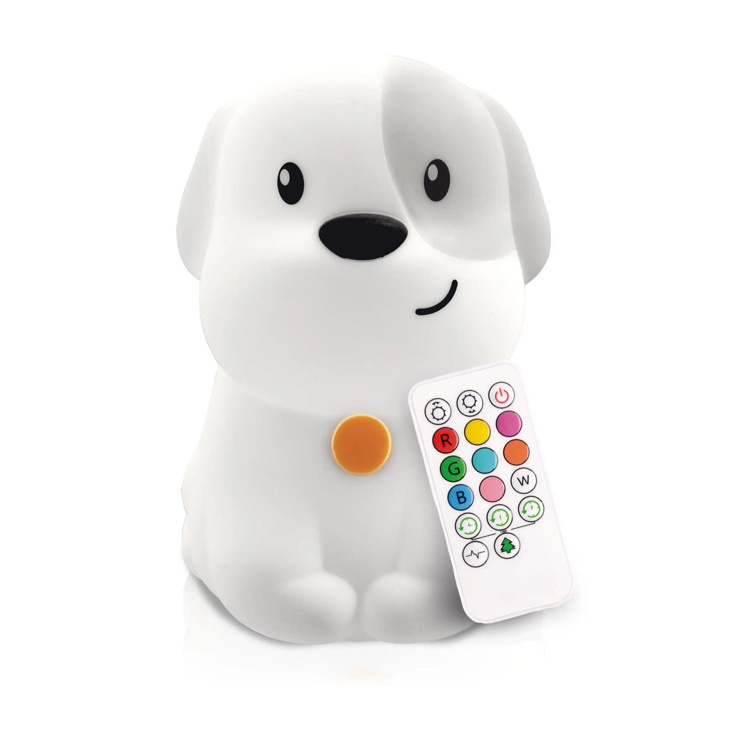 White background with Lumipets® LED Night Light by Lumieworld in Dog. Dog is white with a grey patch over left eye and ear, with black facial features, and a yellow tag, with a white remote.