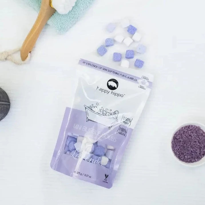 Lavender Mini Bubble Bombs by Happy Hippo Bath on a white surface with other bath essentials. 