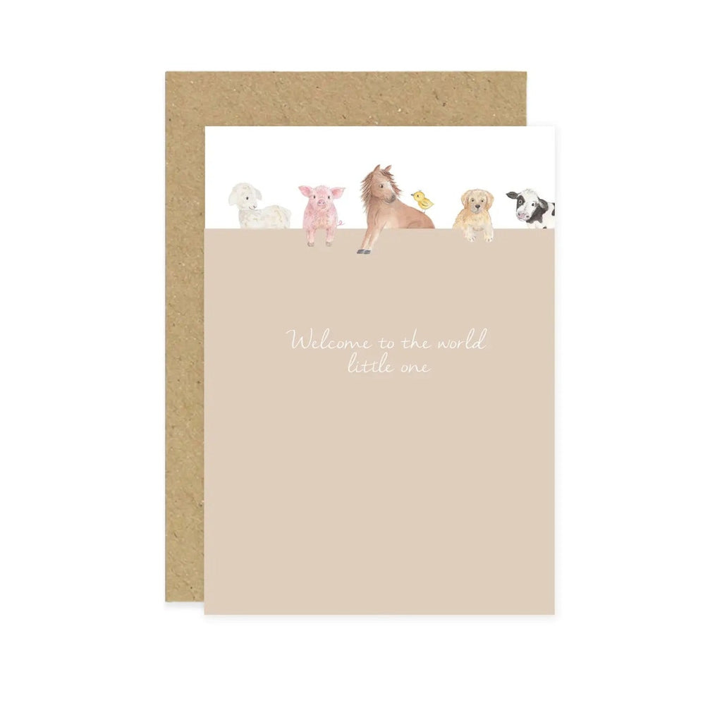 White background with a Kraft paper envelope, and a 'Welcome To The World Little One' Farmyard card by Little Roglets. Card is in portrait style, and it's light brown all over, with a lamb, pig, horse, dug, and duck leaning over the top, with white background behind them and script font that says "Welcome to the world little one".