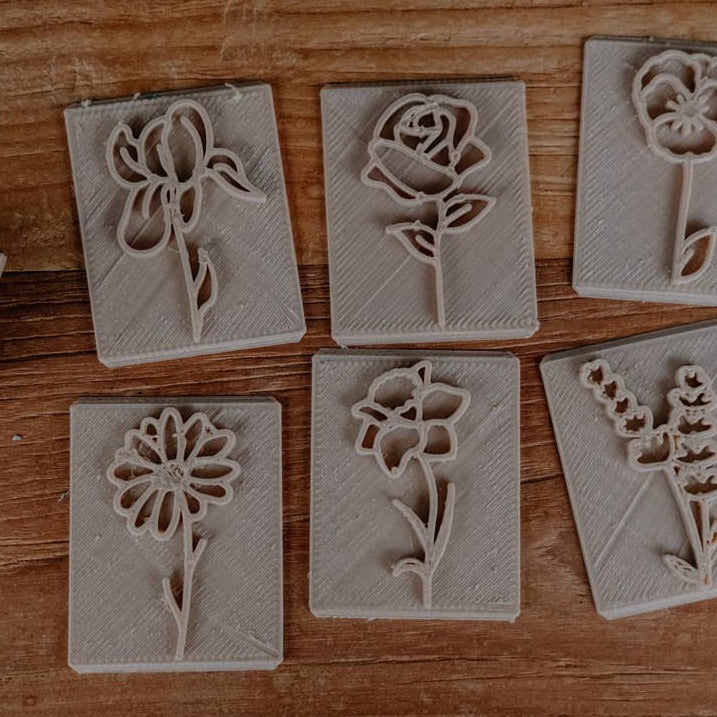 Flower Eco Stamp Set of 7 by Kinfolk Pantry flowers on a wooden table
