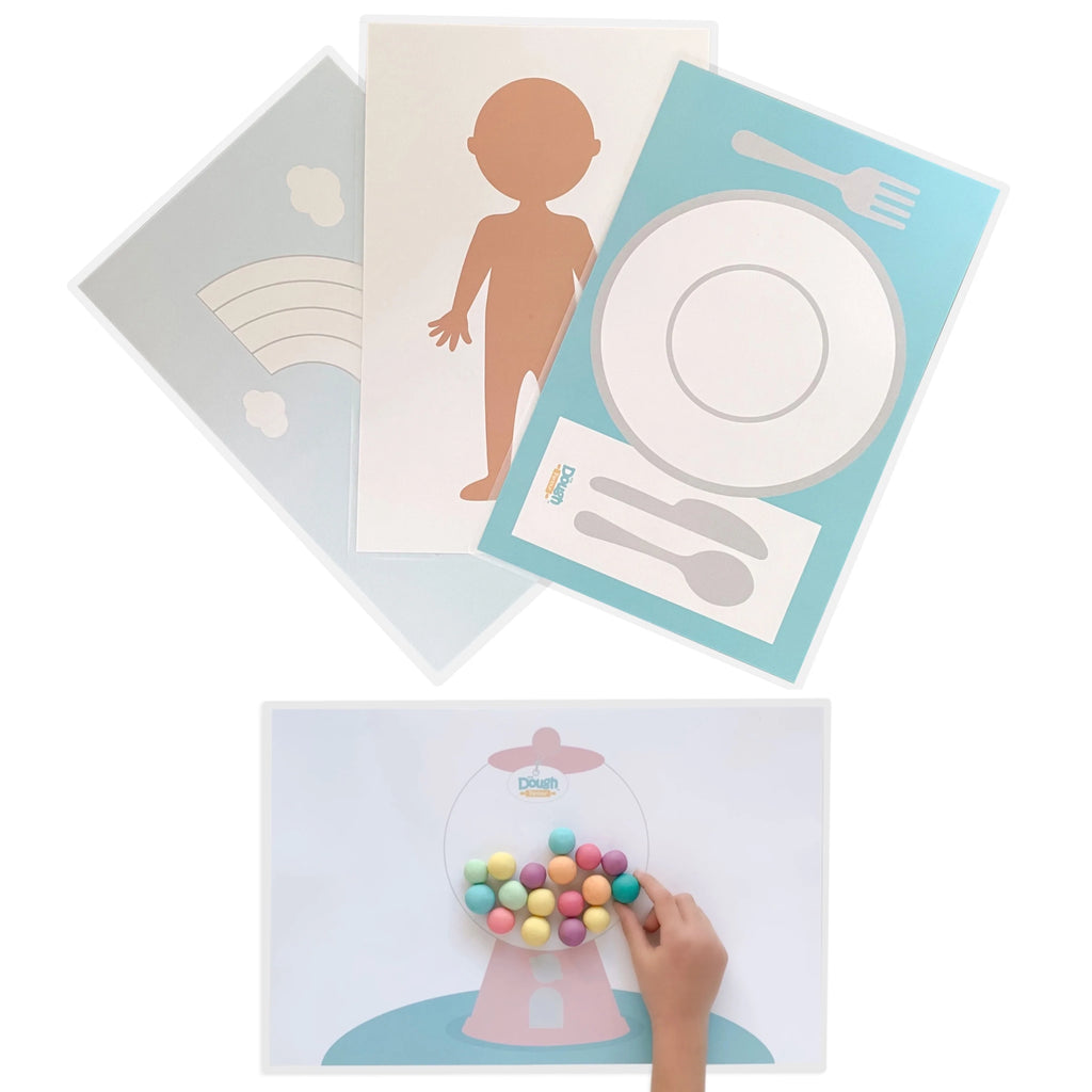 White background with the Creativity Playmats Set by Dough Parlour. First is light blue with a rainbow, second is shaped like a person, third is a table setting with plate, fork, knife and spoon, and last is a gumball machine.
