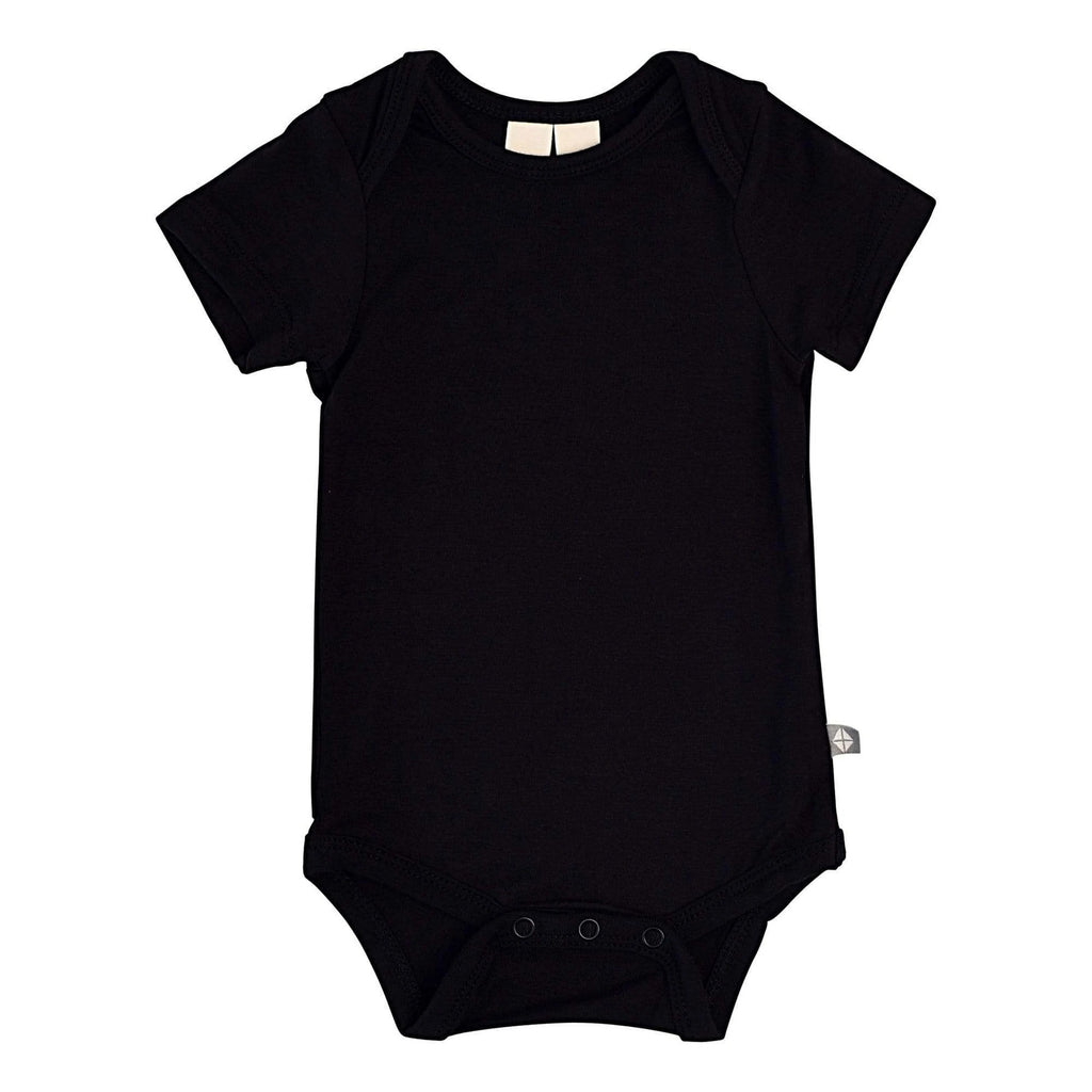 White background with Bodysuit in Midnight by Kyte Baby. Midnight is black, and has snap closure at the bottom,
