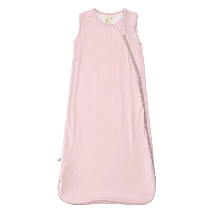 White background with Sleep bag .5 Tog in Blush by Kyte Baby. Sleep bag is a soft pink colour, with a side zipper.