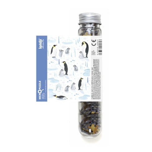 White background with Wildlife Mix Micropuzzle in Penguins by Londji. Puzzle comes in a clear tube.